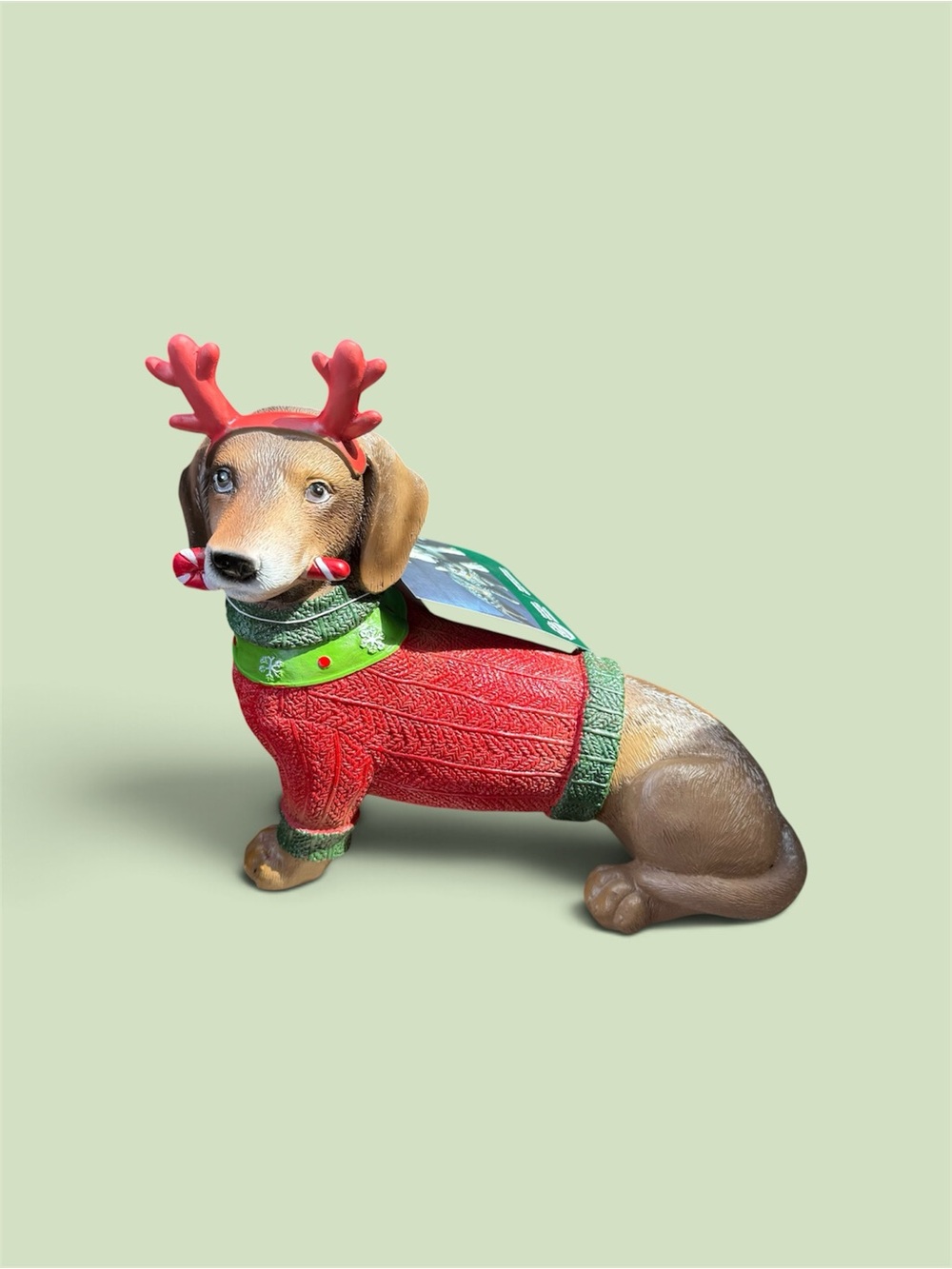 Festive Red Dachshund Dog Statue with Green Accents